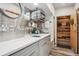 Stylish kitchenette with a sink, microwave, modern cabinets, and elegant countertops at 645 S Park Ave # 302, Breckenridge, CO 80424