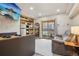 Charming living room with wood-paneled accent wall, slider to balcony, sofa and TV at 645 S Park Ave # 302, Breckenridge, CO 80424