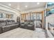 Bright living room with comfortable seating, a modern fireplace, and a sliding door to the balcony at 645 S Park Ave # 302, Breckenridge, CO 80424