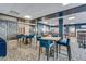 Comfortable lobby seating with modern decor, multiple tables, and a vending machine at 645 S Park Ave # 302, Breckenridge, CO 80424