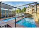 Relaxing pool area with multiple hot tubs, waterfalls, and shaded seating areas at 645 S Park Ave # 302, Breckenridge, CO 80424