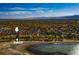 Aerial view of a lake community in autumn with mature trees at 6296 W Prentice Ave, Littleton, CO 80123