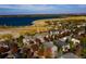 Scenic aerial view of neighborhood and lake; a great location at 6296 W Prentice Ave, Littleton, CO 80123