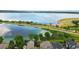 Breathtaking aerial view showcasing a stunning lake with shoreline and walking path, adjacent to beautiful homes at 6296 W Prentice Ave, Littleton, CO 80123