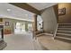 Finished basement with an open layout, a fireplace, and access to the backyard, ideal for entertaining and relaxation at 6296 W Prentice Ave, Littleton, CO 80123