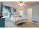 Well-lit bedroom with a unique color scheme, a large window, and a comfortable full-size bed, creating a relaxing atmosphere at 6296 W Prentice Ave, Littleton, CO 80123