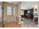 Inviting entryway featuring elegant doors, hardwood floors, and a glimpse into the comfortable living space at 6296 W Prentice Ave, Littleton, CO 80123