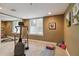 Home exercise room equipped with a treadmill, workout mat, and mirrors, perfect for staying active at 6296 W Prentice Ave, Littleton, CO 80123
