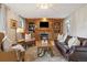 Inviting living room featuring a fireplace, built-in shelves, and a comfortable seating area at 6296 W Prentice Ave, Littleton, CO 80123