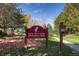 Sign for Jack Anttonen Memorial Park on a bright sunny day with leafy trees at 6296 W Prentice Ave, Littleton, CO 80123