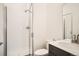 Clean bathroom featuring a shower with glass doors, modern sink and toilet at 370 Geneva St, Aurora, CO 80010