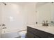 Clean bathroom featuring a bathtub, a shower, and a modern vanity at 370 Geneva St, Aurora, CO 80010