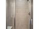 Tiled shower stall with glass doors and shower head at 370 Geneva St, Aurora, CO 80010