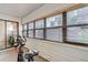 Sunroom featuring natural light from multiple windows and containing exercise equipment at 9797 E Peakview Ave # C1, Englewood, CO 80111