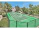 A pristine tennis court invites residents to engage in friendly matches amid lush surroundings at 9797 E Peakview Ave # C1, Englewood, CO 80111