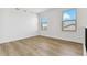 Bright bedroom with hardwood floors, two windows offering nice views and white trim at 42964 Colonial Trl, Elizabeth, CO 80107