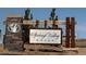Signage at Spring Valley Ranch shows a stone pillar entrance way to the homes at 42964 Colonial Trl, Elizabeth, CO 80107