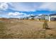 View of the community and landscape featuring modern homes and a walking path under a blue sky at 16568 W 92Nd Pl, Arvada, CO 80007