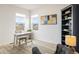 Bright home office featuring large windows and stylish decor, creating an inviting workspace at 16568 W 92Nd Pl, Arvada, CO 80007