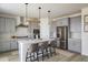 Bright kitchen featuring a large island, stainless steel appliances, and ample cabinet space at 16568 W 92Nd Pl, Arvada, CO 80007
