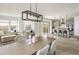 Open-concept living space, featuring a kitchen, living room, and dining area at 16568 W 92Nd Pl, Arvada, CO 80007