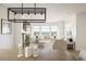 Spacious living and dining area with ample natural light, a fireplace, and modern decor at 16568 W 92Nd Pl, Arvada, CO 80007