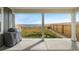Covered patio with lake views, ideal for outdoor living and entertaining at 16568 W 92Nd Pl, Arvada, CO 80007