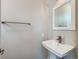 A well-lit half bathroom features a modern sink and mirror at 1246 Xavier St, Denver, CO 80204