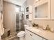 Modern bathroom features a glass enclosed shower with updated fixtures and finishes at 1246 Xavier St, Denver, CO 80204