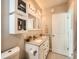 Bright bathroom features double sinks, updated cabinets, and a modern design at 1246 Xavier St, Denver, CO 80204