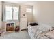 Cozy bedroom with natural light, neutral color palette, and comfortable furnishings at 1246 Xavier St, Denver, CO 80204