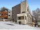 Modern multi-level home with contemporary architectural details and neutral color palette nestled into a snow covered landscape at 1246 Xavier St, Denver, CO 80204