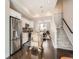 Modern open-concept kitchen with white cabinets, stainless steel appliances, an island, and sleek design at 1246 Xavier St, Denver, CO 80204