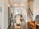 A modern living room flows into an open kitchen with stainless steel appliances and hardwood floors at 1246 Xavier St, Denver, CO 80204