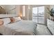 The serene main bedroom boasts a sliding glass door and a large window at 1246 Xavier St, Denver, CO 80204