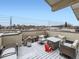 Outdoor patio with dining table and mountain views at 1246 Xavier St, Denver, CO 80204