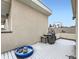 A rooftop patio features wooden flooring, a grill, and scenic views of neighboring rooftops at 1246 Xavier St, Denver, CO 80204