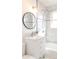 Updated bathroom with a sleek vanity, modern fixtures, and a tiled shower and tub for a spa-like feel at 1476 W Dakota Ave, Denver, CO 80223