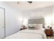 Bright bedroom with a comfortable bed, bedside tables, soft lighting, and a neutral color palette at 1476 W Dakota Ave, Denver, CO 80223