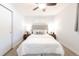 Bedroom featuring a cozy bed, matching nightstands, and a ceiling fan for added comfort at 1476 W Dakota Ave, Denver, CO 80223