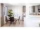 Modern dining area with stylish seating, contemporary lighting, and an open layout connected to the kitchen at 1476 W Dakota Ave, Denver, CO 80223