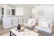 Stylish living room featuring contemporary seating, modern decor, and an open layout with a breakfast bar at 1476 W Dakota Ave, Denver, CO 80223