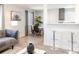 Bright living space with modern decor, an open floor plan, and seamless flow between living, dining, and kitchen areas at 1476 W Dakota Ave, Denver, CO 80223