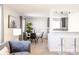 Open-concept living space with sleek finishes, modern furniture, and natural light creating a welcoming atmosphere at 1476 W Dakota Ave, Denver, CO 80223
