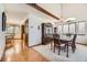 Dining area with hardwood floors, a large china cabinet, and natural light from windows at 6726 Taft Cir, Arvada, CO 80004