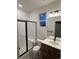 Bathroom with a standing shower with a bench, toilet, vanity, and window at 5621 W 141St Ln, Broomfield, CO 80020