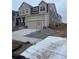Side view of a two-story home with a two-car garage showcasing landscaping potential at 5621 W 141St Ln, Broomfield, CO 80020