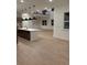 Modern kitchen with a large island, stainless steel appliances, and sleek pendant lighting at 5621 W 141St Ln, Broomfield, CO 80020