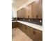 A kitchen featuring long counters and overhead wood cabinets against the backsplash at 5621 W 141St Ln, Broomfield, CO 80020