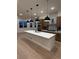 Close-up of a modern kitchen showcasing a gas cooktop, stylish backsplash, and stainless steel hood at 5621 W 141St Ln, Broomfield, CO 80020